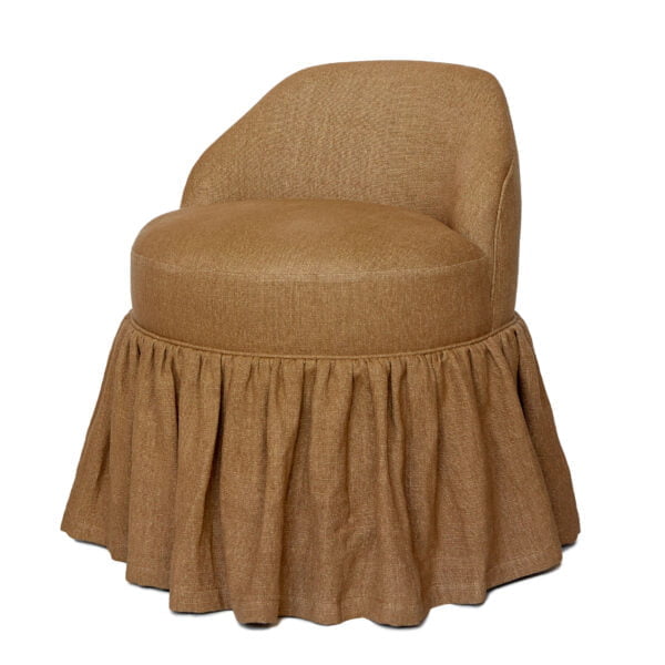 A small, camel-coloured seven chair with a skirted edge.